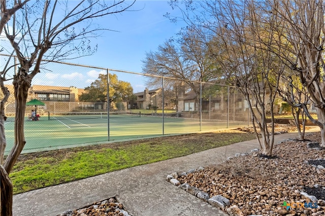 view of sport court with fence