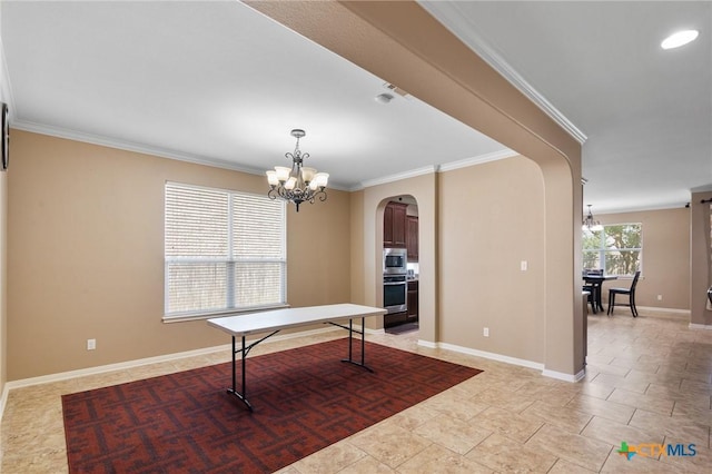 106 Sandstone Ct, Victoria, TX 77904 - dining room with a chandelier, arched walkways, ornamental molding, and baseboards