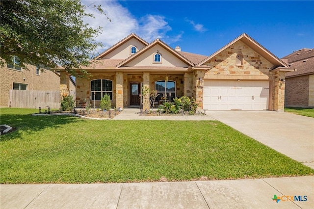 106 Sandstone Ct, Victoria, TX 77904 - view of front of house with a garage, driveway, stone siding, a chimney, and a porch