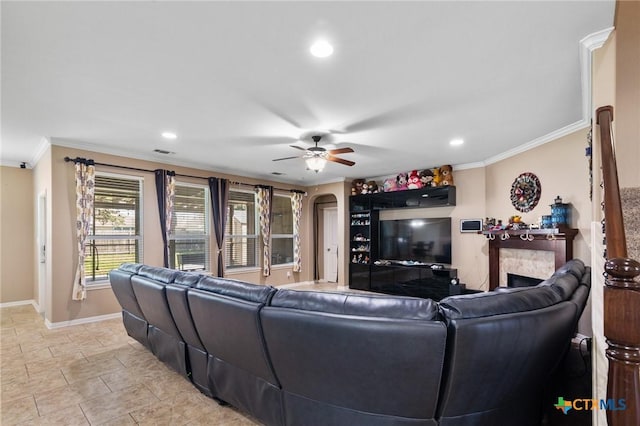 106 Sandstone Ct, Victoria, TX 77904 - living room featuring ornamental molding, a ceiling fan, baseboards, recessed lighting, and a fireplace