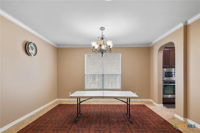 106 Sandstone Ct, Victoria, TX 77904 - dining room with arched walkways, a chandelier, ornamental molding, and baseboards