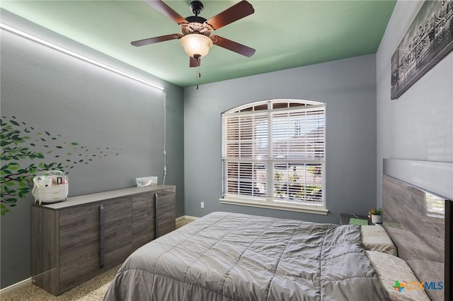 106 Sandstone Ct, Victoria, TX 77904 - bedroom featuring baseboards, ceiling fan, and carpet