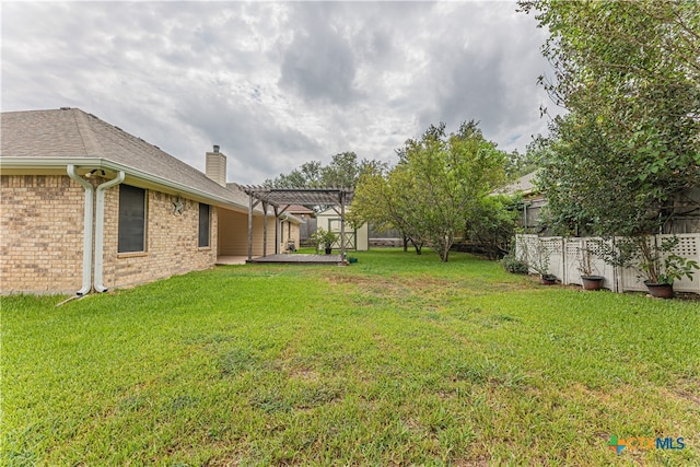 view of yard featuring a patio and a pergola