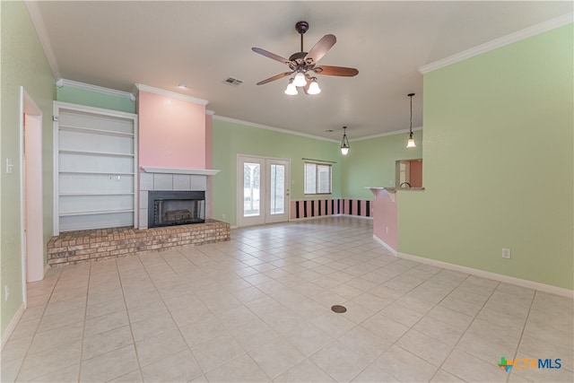 unfurnished living room featuring built in features, light tile patterned flooring, crown molding, and ceiling fan