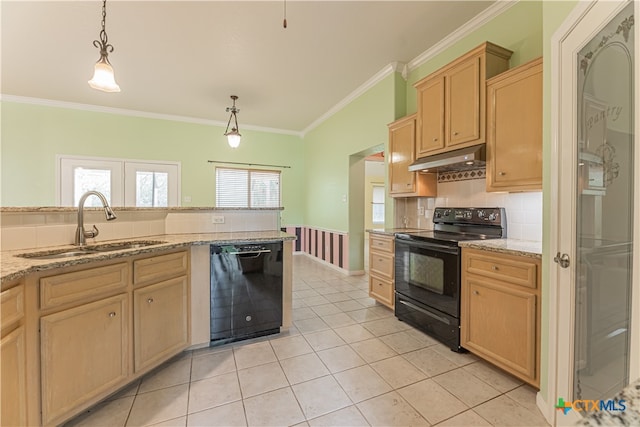 kitchen with light brown cabinetry, sink, black appliances, and decorative light fixtures