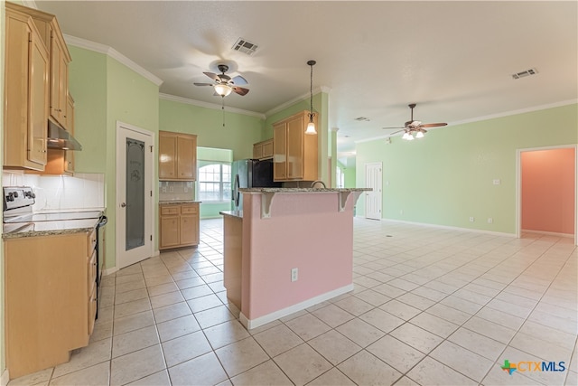 kitchen featuring a breakfast bar area, light tile patterned floors, decorative light fixtures, range with electric cooktop, and crown molding