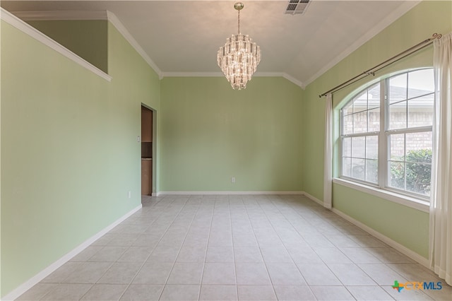 empty room with an inviting chandelier, light tile patterned floors, ornamental molding, and vaulted ceiling