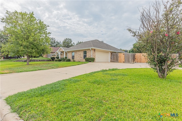 ranch-style house with a garage and a front lawn