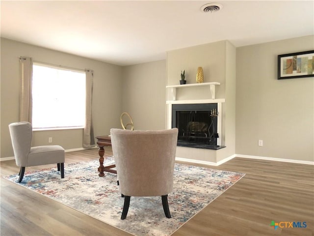 103 W Outer Dr, Canyon Lake, TX 78133 - dining room with baseboards, wood finished floors, and a fireplace