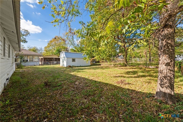 view of yard featuring cooling unit and an outdoor structure