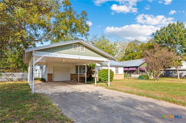 bungalow with a front lawn and a carport