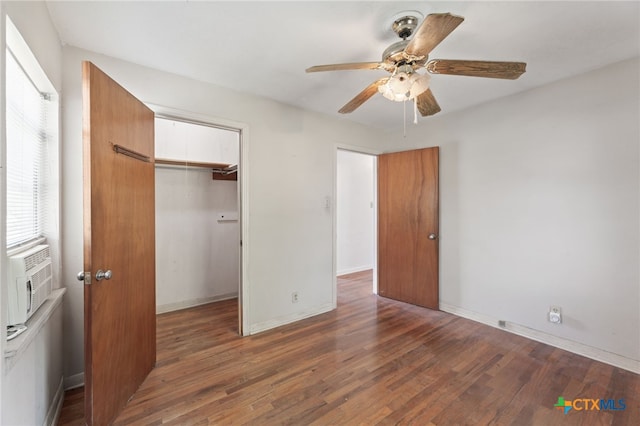 unfurnished bedroom featuring dark hardwood / wood-style flooring, a closet, and ceiling fan