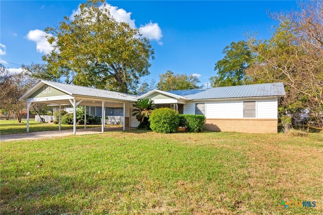 ranch-style home with a carport and a front yard