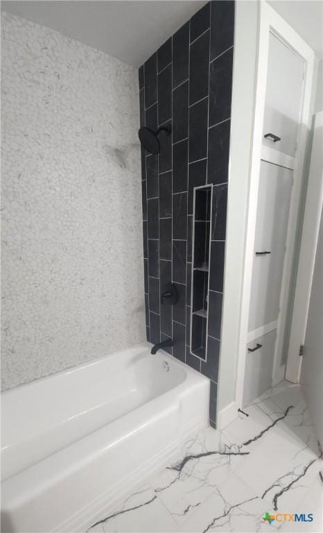 full bathroom featuring shower / bath combination and marble finish floor