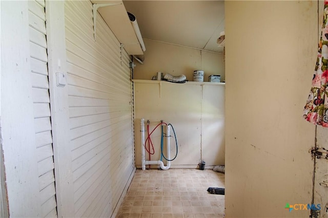 clothes washing area featuring hookup for a washing machine and tile patterned floors