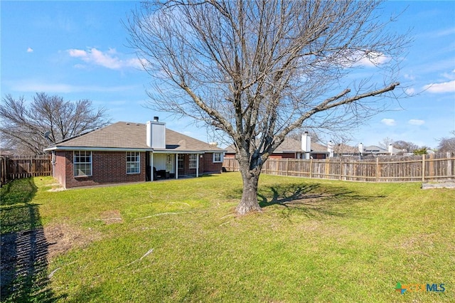 view of yard featuring a fenced backyard