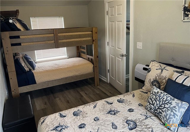 bedroom with wood finished floors