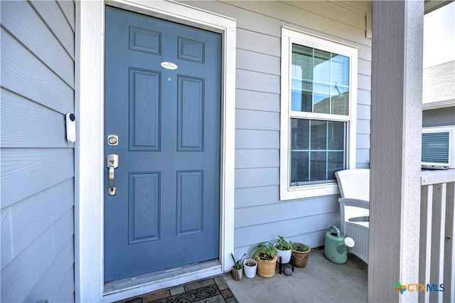 property entrance featuring covered porch