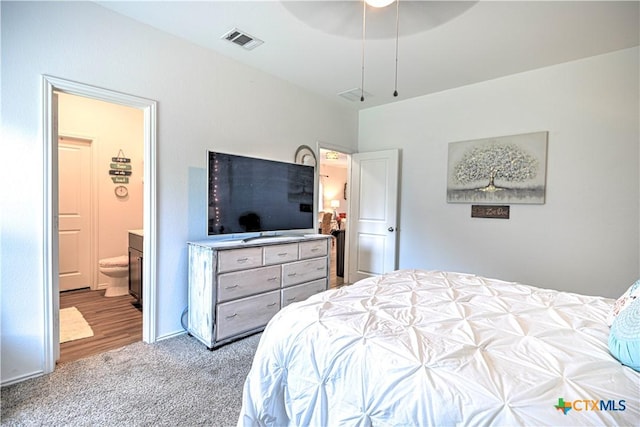 bedroom with carpet and ensuite bathroom