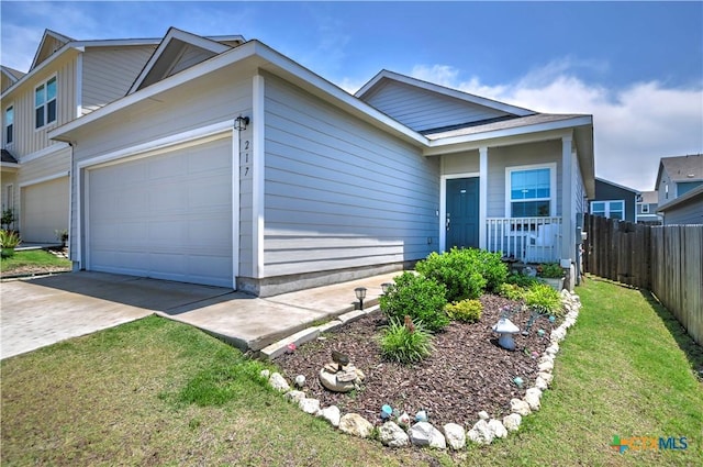 view of front of home with a garage and concrete driveway