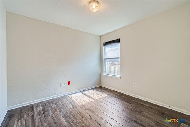 10122 Divine Breeze, San Antonio, TX 78251 - spare room with dark wood-style flooring and baseboards