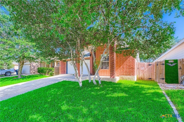 10122 Divine Breeze, San Antonio, TX 78251 - obstructed view of property with concrete driveway, an attached garage, and brick siding