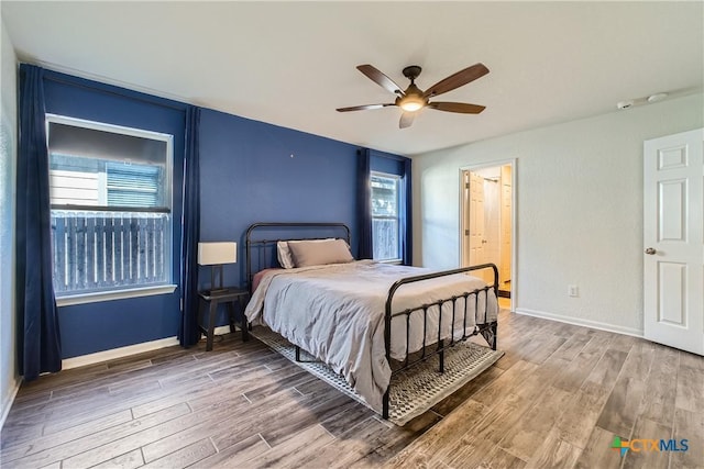 10122 Divine Breeze, San Antonio, TX 78251 - bedroom with wood finished floors and a ceiling fan