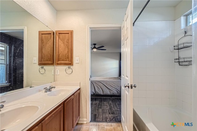 10122 Divine Breeze, San Antonio, TX 78251 - ensuite bathroom featuring double vanity, shower / bath combination, and ceiling fan
