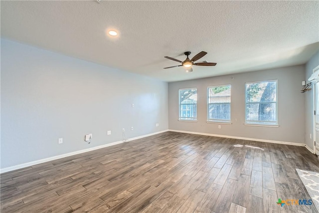 10122 Divine Breeze, San Antonio, TX 78251 - unfurnished room with ceiling fan, dark wood finished floors, a textured ceiling, and recessed lighting