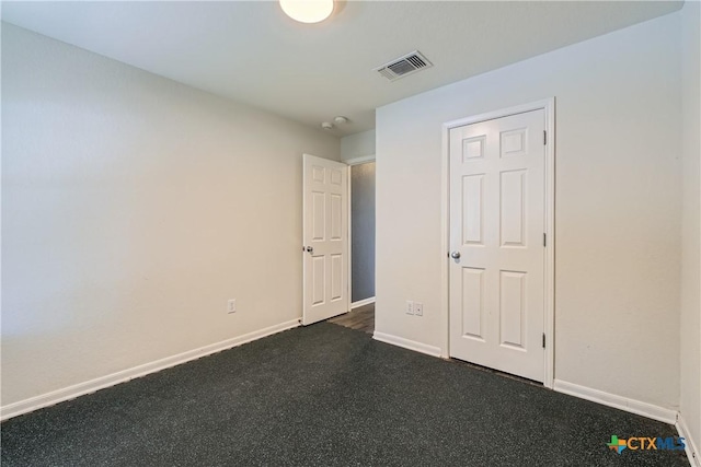 10122 Divine Breeze, San Antonio, TX 78251 - unfurnished bedroom with baseboards and dark carpet