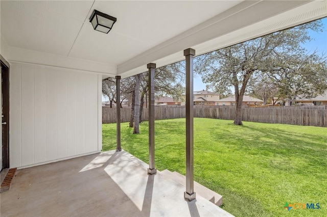 view of yard with a patio area and a fenced backyard