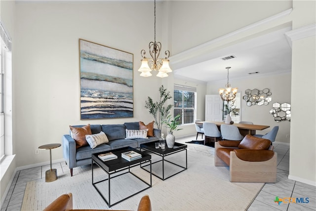 living area with a notable chandelier, visible vents, ornamental molding, baseboards, and tile patterned floors