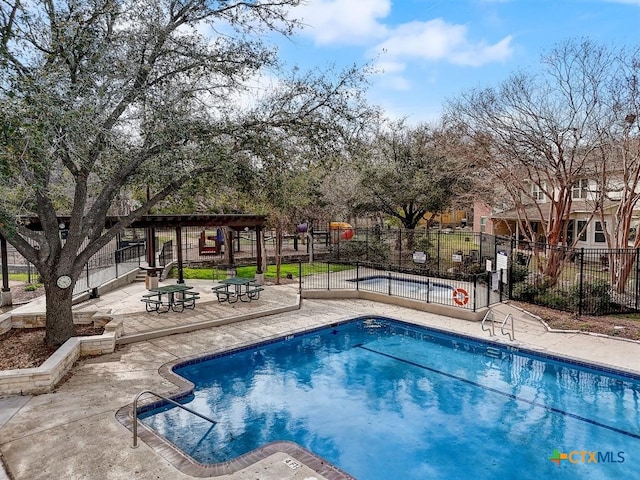 pool featuring fence and a patio