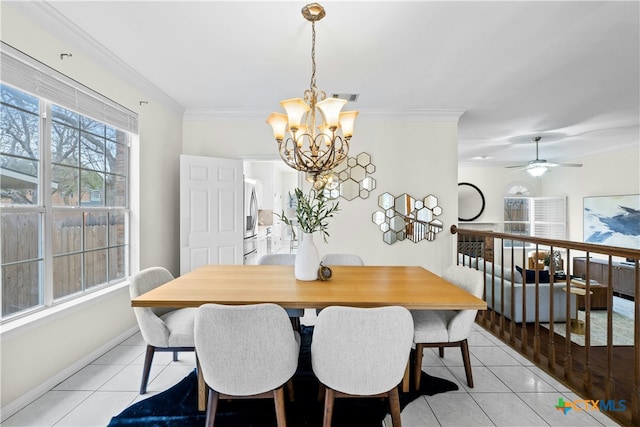 dining room with light tile patterned floors, baseboards, visible vents, and crown molding