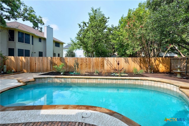 view of pool with a fenced in pool and a fenced backyard