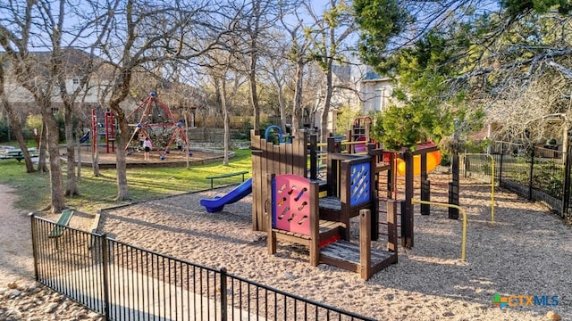 communal playground featuring fence