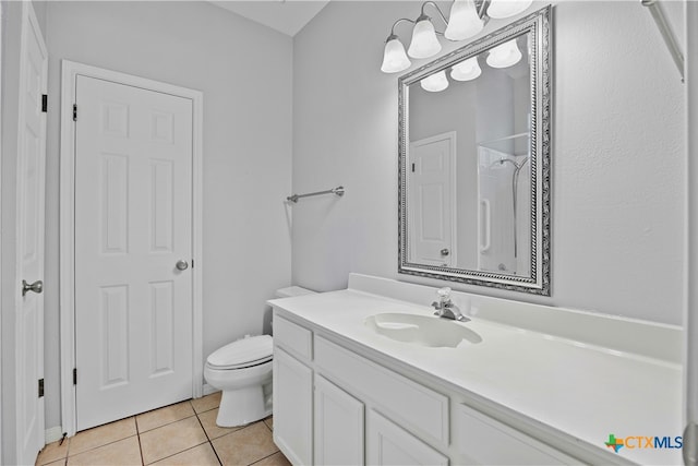 full bathroom with a shower, vanity, toilet, and tile patterned floors