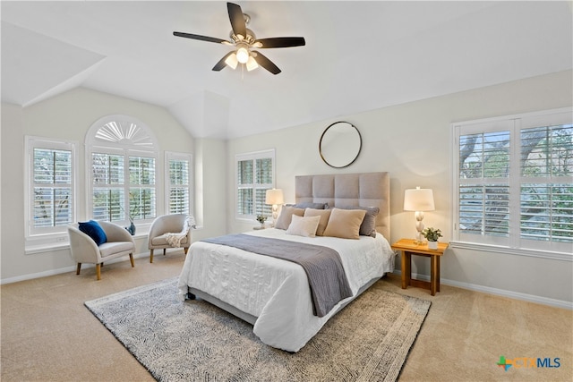 bedroom with lofted ceiling, carpet, baseboards, and a ceiling fan