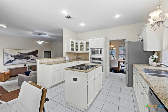 kitchen with white cabinetry, visible vents, appliances with stainless steel finishes, and a sink