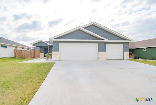 view of front of home featuring a garage and a front yard