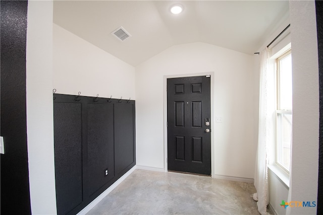 foyer featuring vaulted ceiling