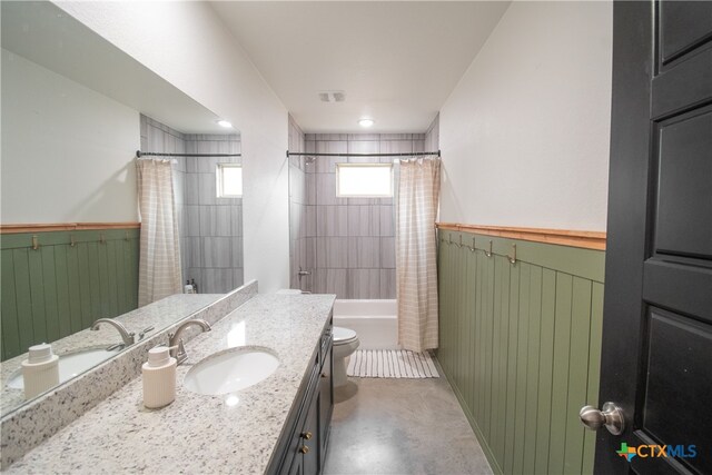 full bathroom with toilet, concrete flooring, vanity, and shower / bathtub combination with curtain