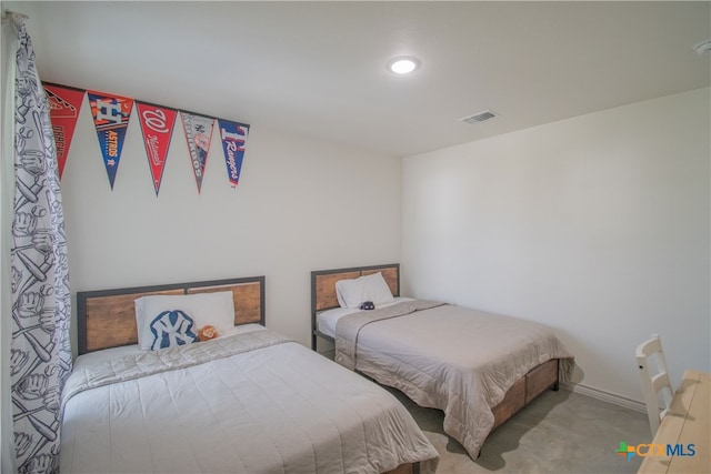 bedroom featuring light colored carpet