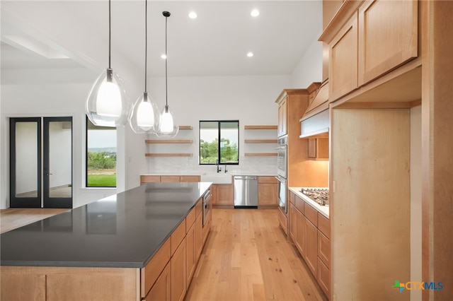 1123 Vintage Way, New Braunfels, TX 78132 - kitchen with open shelves, appliances with stainless steel finishes, a spacious island, light wood-type flooring, and tasteful backsplash