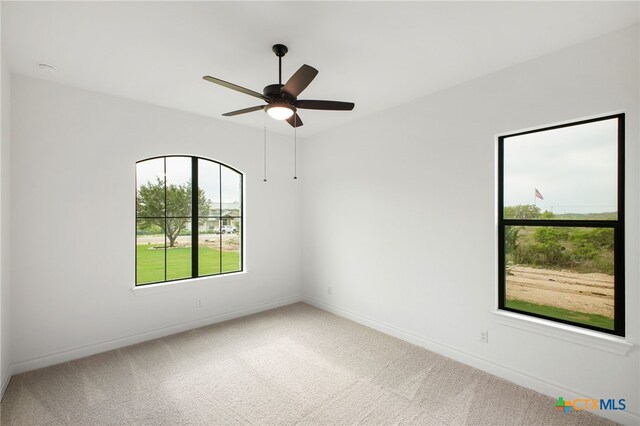 1123 Vintage Way, New Braunfels, TX 78132 - spare room featuring healthy amount of natural light, carpet flooring, and a ceiling fan