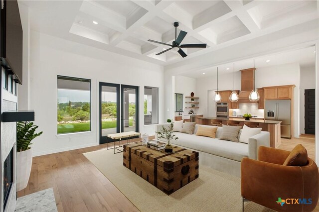 1123 Vintage Way, New Braunfels, TX 78132 - living room with a towering ceiling, recessed lighting, beam ceiling, light wood finished floors, and ceiling fan