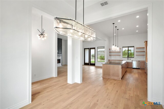 1123 Vintage Way, New Braunfels, TX 78132 - kitchen with open shelves, light wood-type flooring, dishwasher, a kitchen island, and recessed lighting