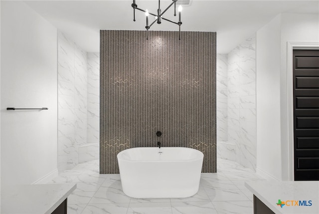 1123 Vintage Way, New Braunfels, TX 78132 - full bathroom with marble tiled flooring, a soaking tub, vanity, a marble finish shower, and a chandelier
