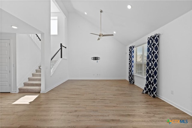 interior space featuring recessed lighting, light wood-style flooring, stairway, and a ceiling fan