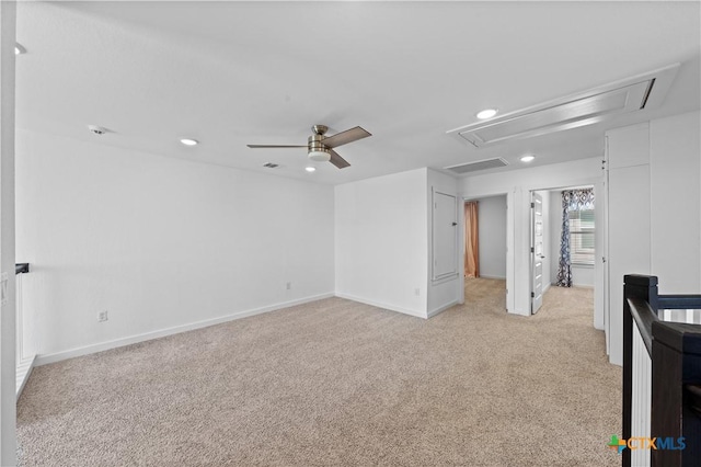interior space featuring visible vents, recessed lighting, a ceiling fan, attic access, and light colored carpet